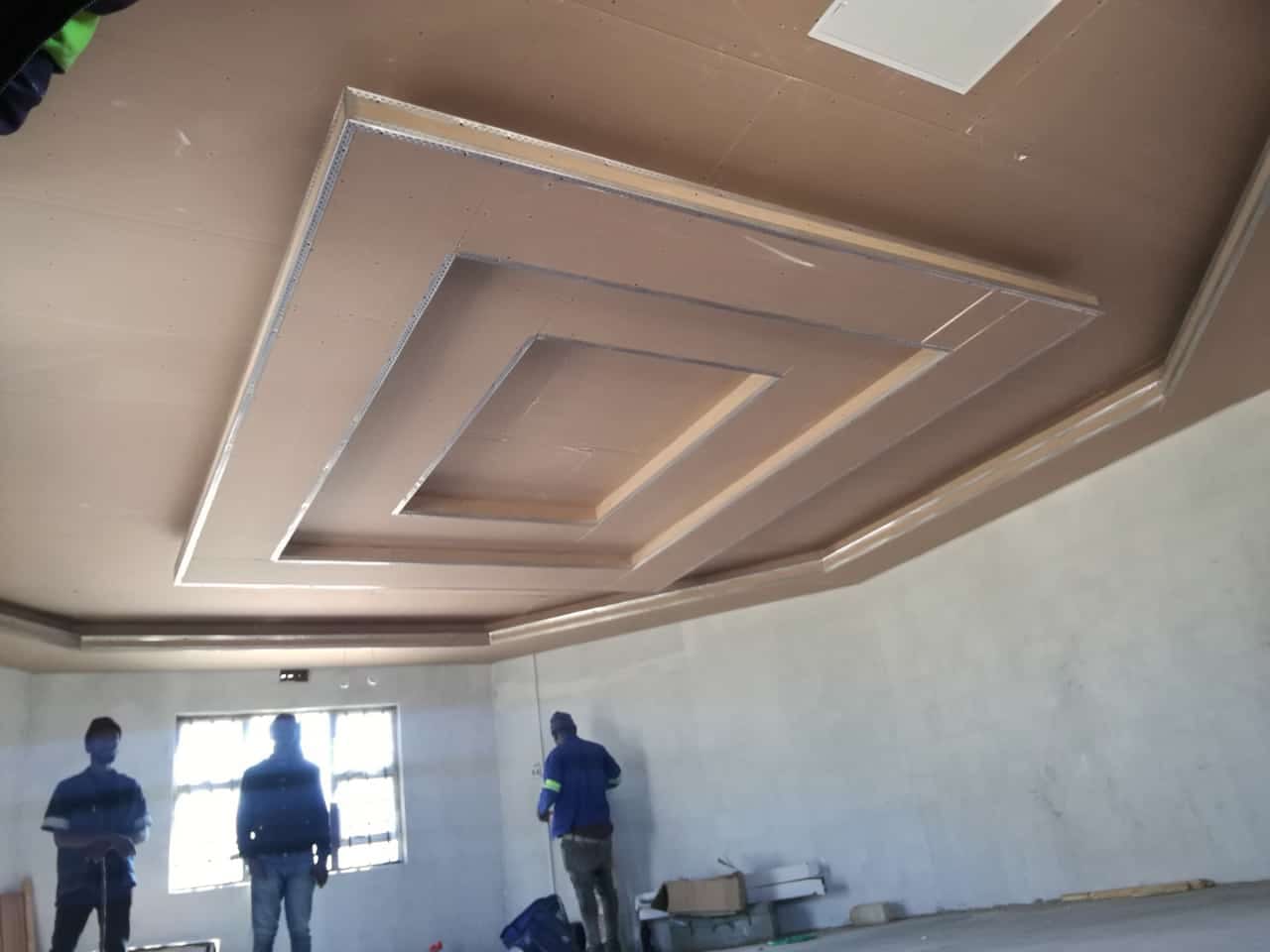 Coffered bulkhead ceiling during installation