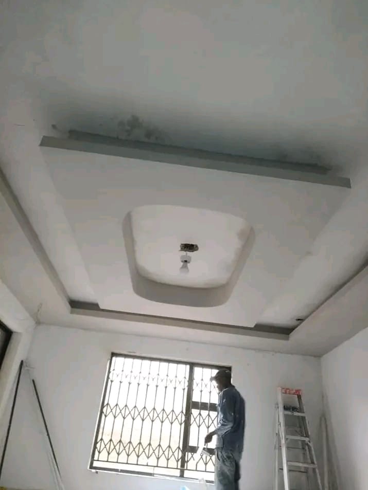 Painter finishing a tray ceiling