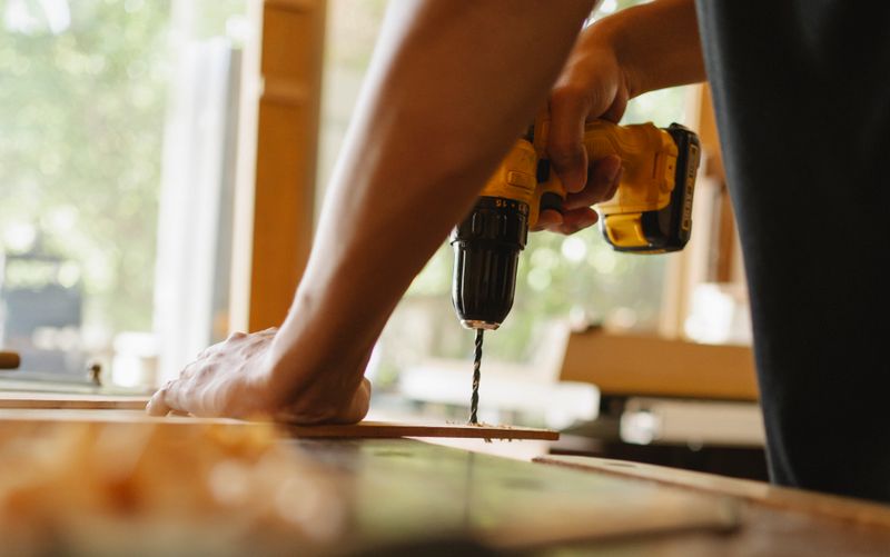 Drilling timber plank during a repair